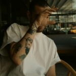 Are You Giving Off “Bad Vibes”? tattooed man smoking a cigarette