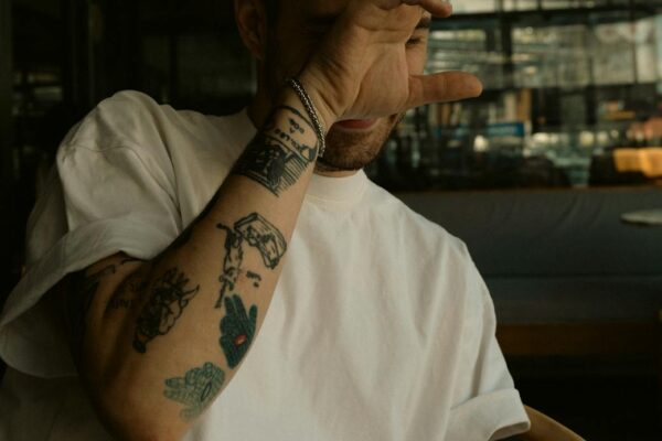 Are You Giving Off “Bad Vibes”? tattooed man smoking a cigarette