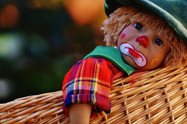 Why Does it Feel Like Everyone Hates You? sad clown doll in basket